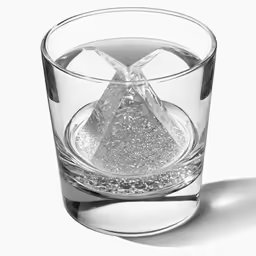 a clear glass with a small rock in the middle