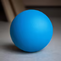 a blue colored object is on a white surface