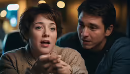 a woman making a surprised face in front of an unknown man