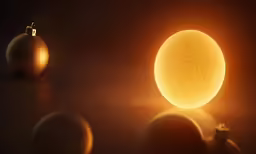 glowing golden christmas ornaments against dark background