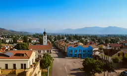 an image of a town with a large clock tower