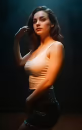 a beautiful woman in short skirt and tank top posing