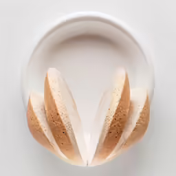 a white plate topped with cut up bread