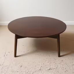 a close up shot of a coffee table on carpet