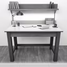 desk on a wooden floor next to a white wall