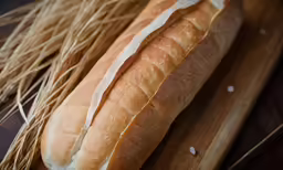 a close up of two long loaves of bread