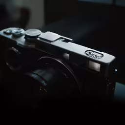 a black camera sitting on top of a table