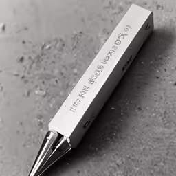 a pen is stuck in the paper it is holding