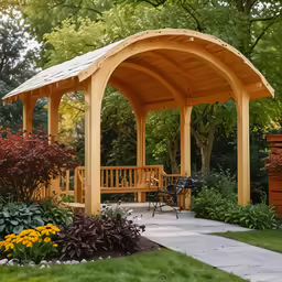 a wood gazebo and seating area in a garden