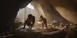 two people on top of bed with a dog