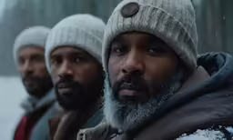 three men wearing winter clothes with hats and scarves