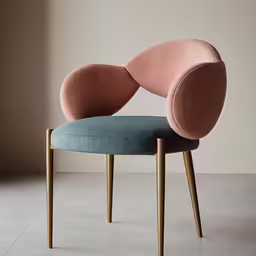 a pink chair with blue cushion on it