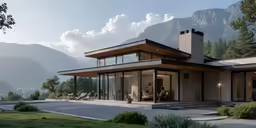 an exterior view of a glass - framed house in the mountains