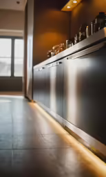 a very clean modern style kitchen with metallic cabinets