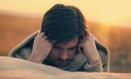 the young man is trying to understand something