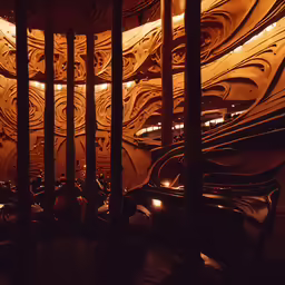 several curved stairs in a building with lights