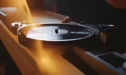 a vinyl player playing music on a turntable