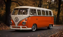 an orange and white vw bus parked on a road