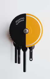 two different colored discs attached to a metal object