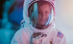 the woman is dressed in an astronaut suit