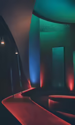 the back wall of a room lit up with colored lights