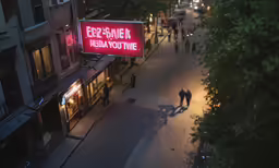 a street with a large advertisement on the side