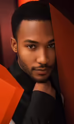 an image of a man with black hair posing for a portrait