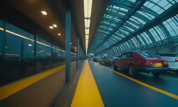traffic on a large highway with an indoor walkway
