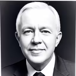 black and white photo of an older man in suit and tie