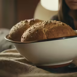 a bowl that has some bread inside of it