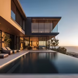 a home overlooking the ocean with a pool