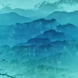 green clouds are falling down in the blue mountains