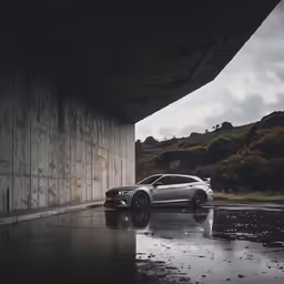 a car is parked in a wet driveway