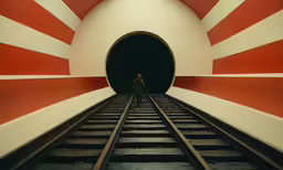 there is a man standing in a tunnel