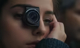 a woman looking into the lens of an eye doctor