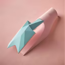 an abstract artistic pink and blue object laying on the floor