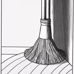 a broom standing on a hard wood floor