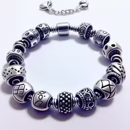 a black and silver bracelet with some charms on it,a charm bracelet with several different colors and designs
