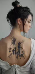 a woman with a tattoo on her back