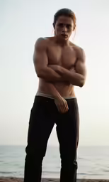 the male is wearing a pair of black pants