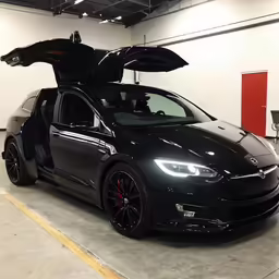 a car with an open hood is parked in the garage