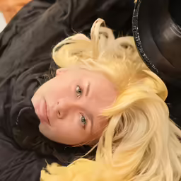 the blonde woman is wearing an all yellow wig