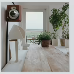 a room with wood table and a clock on the wall