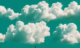 a bunch of clouds flying over one another