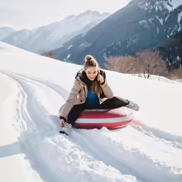 the woman is in snow gear riding on her body