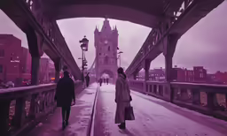 a couple of people walk down a bridge