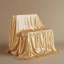 a brown chair with tassels on the back