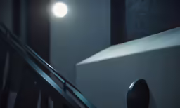 an object with a bright light shines brightly on a wall