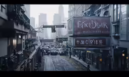 a rainy city scene of cars on a road