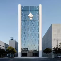 a glass facade of a building with geometric details